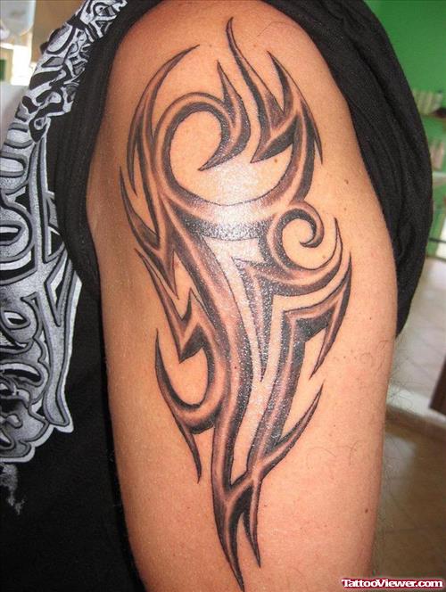 Grey Ink Tribal Arm Tattoo