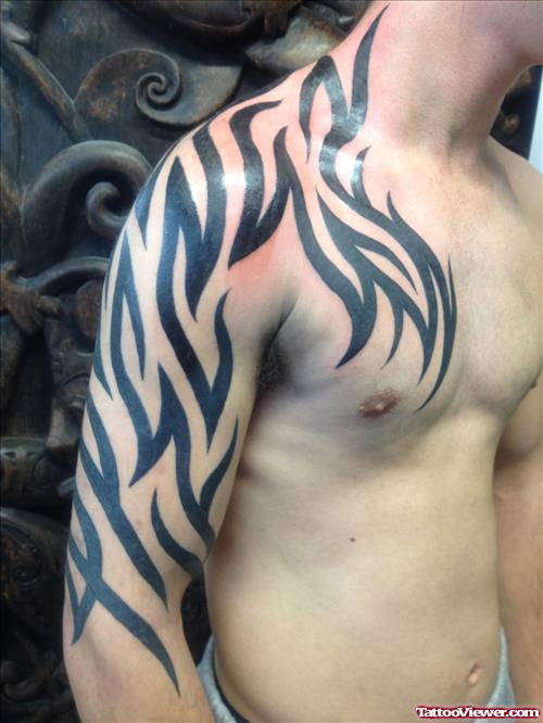 Best Black Ink Tribal Tattoo On chest And Right Arm