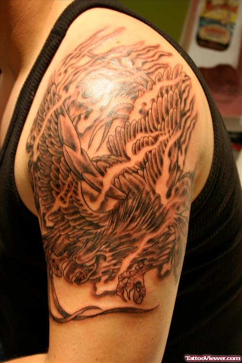 Grey Ink Flying Eagle Tattoo On Left Arm