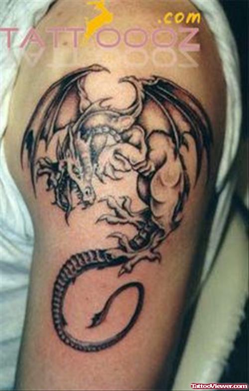 Grey Ink Dragon Arm Tattoo