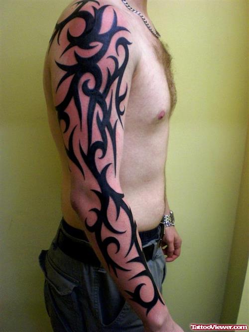Fantastic Black Ink Tribal Tattoo On Man Right Arm