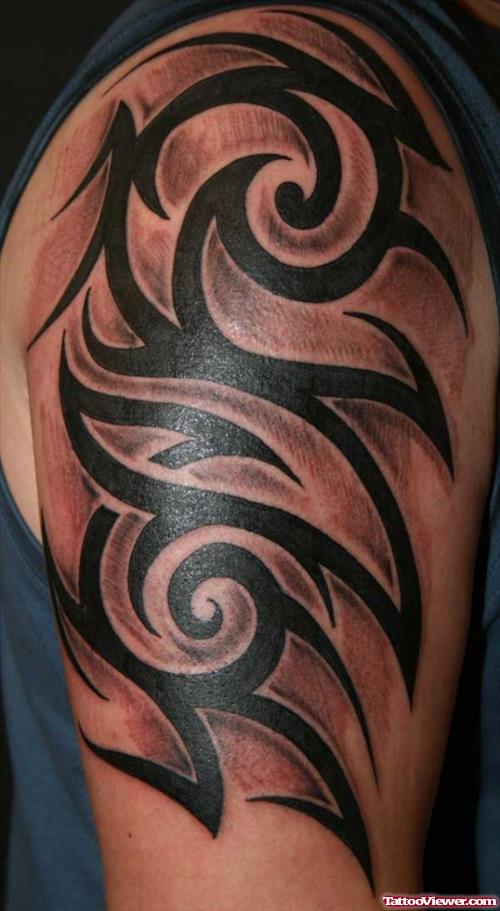 Awesome Black Ink Tribal Arm Tattoo