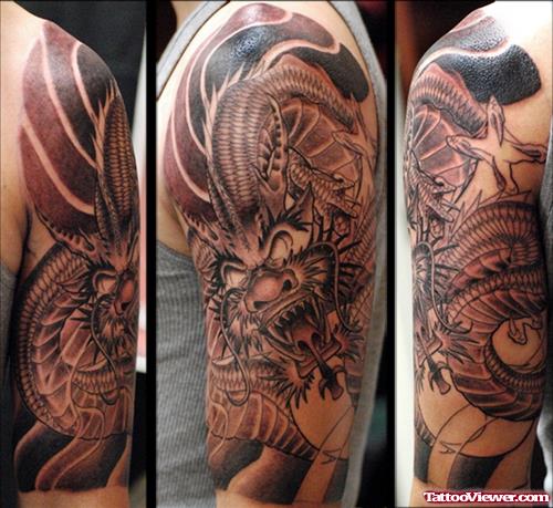Grey Ink Dragon Tattoo On Left