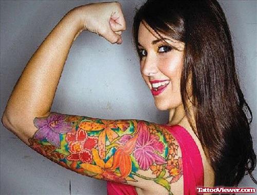 Girl Showing Colored Flowers Arm Tattoo