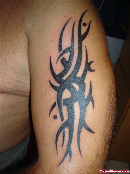 Black Tribal Tattoo On Arm For Men