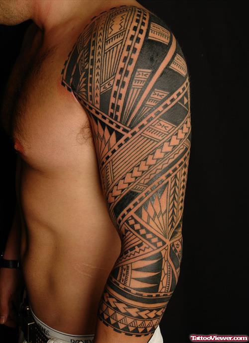 Grey Ink Polynesian Tattoo On Man Left Arm