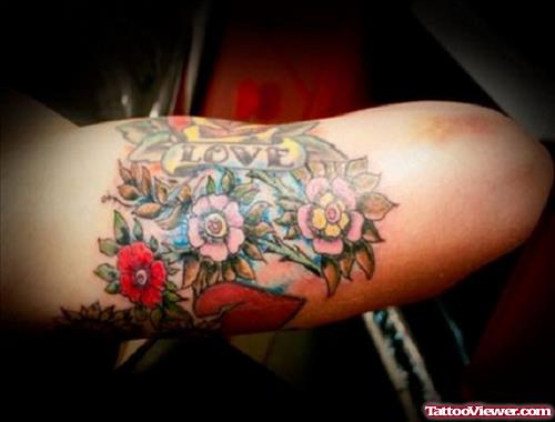 Colored Flowers Arm Tattoo