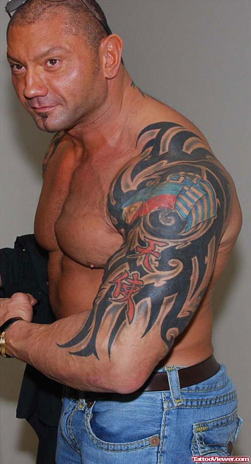 Black Ink Tribal Tattoo On Batista Left Arm