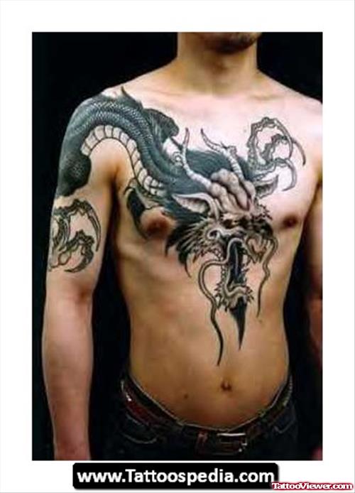 Black Ink Dragon Tattoo On Chest And Arm