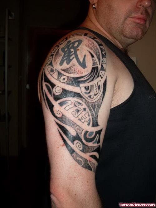 Classic Black Ink Tribal Tattoo On Right Arm