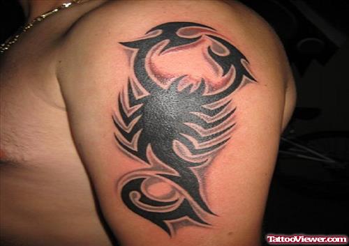 Black Ink Tribal Scorpio Tattoo On Left Shoulder