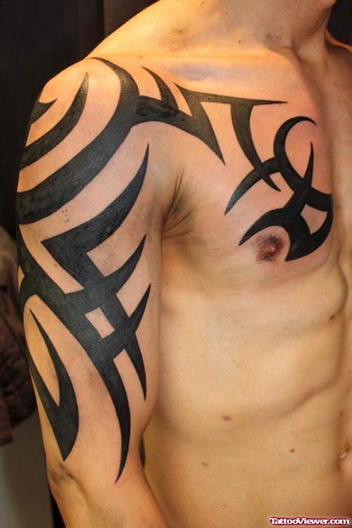 Black Ink Tribal Tattoo On Chest And Right Arm
