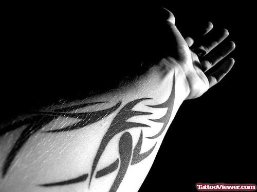 Black Ink Tribal Tattoo On Left Forearm