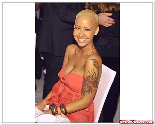 Amber Rose with Red Flowers Tattoos On Left Arm