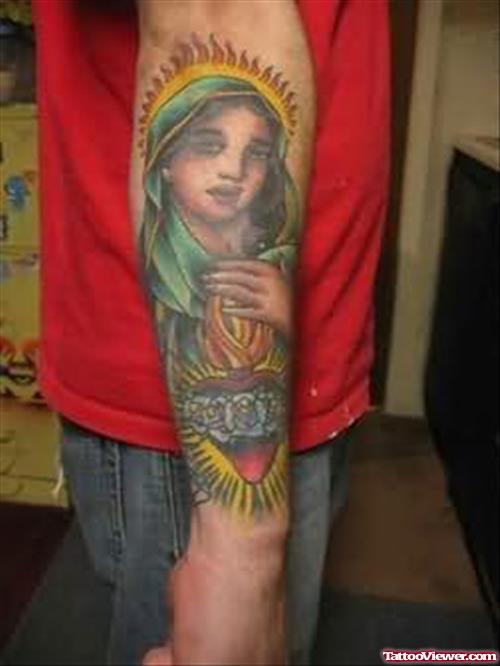 Jesus-Mary Face Tattoo On Arm
