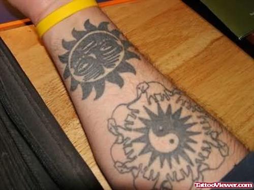 Yin Yang Tattooed On Arm