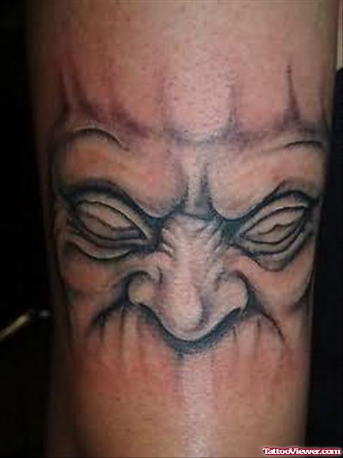 Big Face Tattoo On Arm