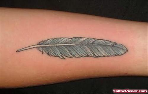 Simple Feather Tattoo On Arm