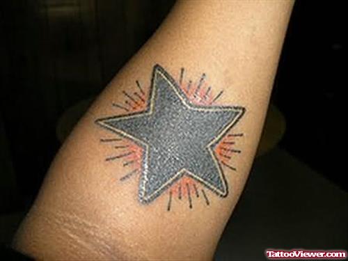 Sun And Star Tattoo On Arm