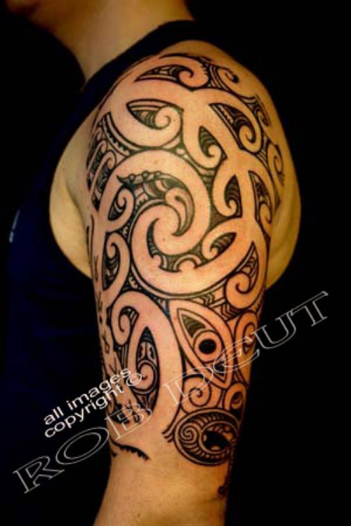 Beautiful Black Ink Tribal Tattoo On Left Half Sleeve