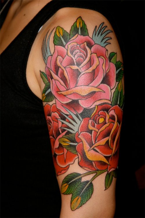 Colored Rose Flowers Tattoo On Arm