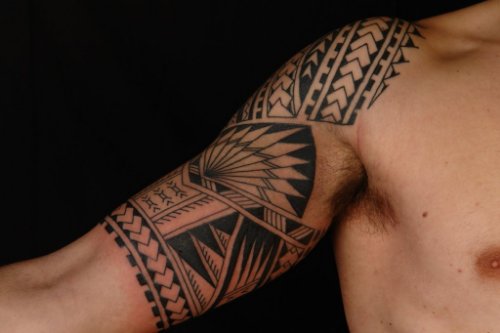Grey Ink Polynesian Tattoo On Man Right Arm