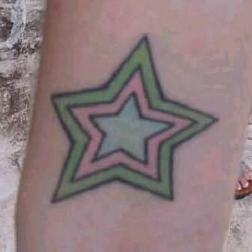 Bold Star Tattoo On Arm