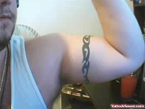 Guy Showing Left Bicep Armband Tattoo