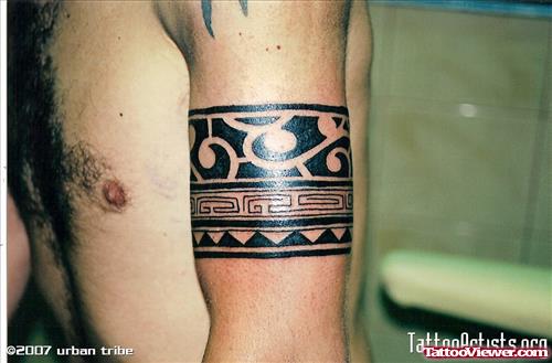 Black Ink Armband Tattoo On Man Left Bicep