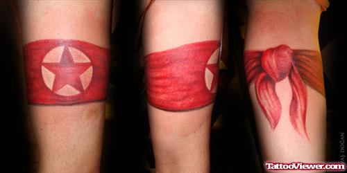 Red Ink Star Bow Armband Tattoo On Arm