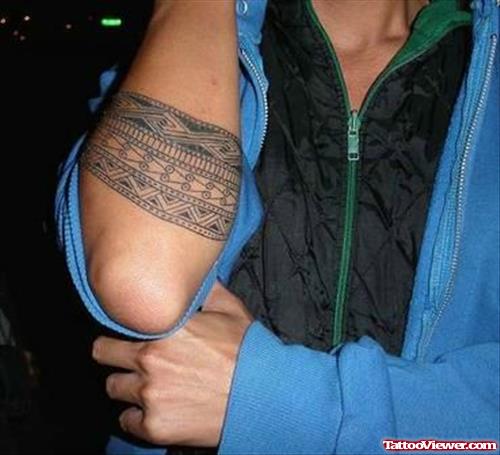 Man Showing His Armband Tattoo
