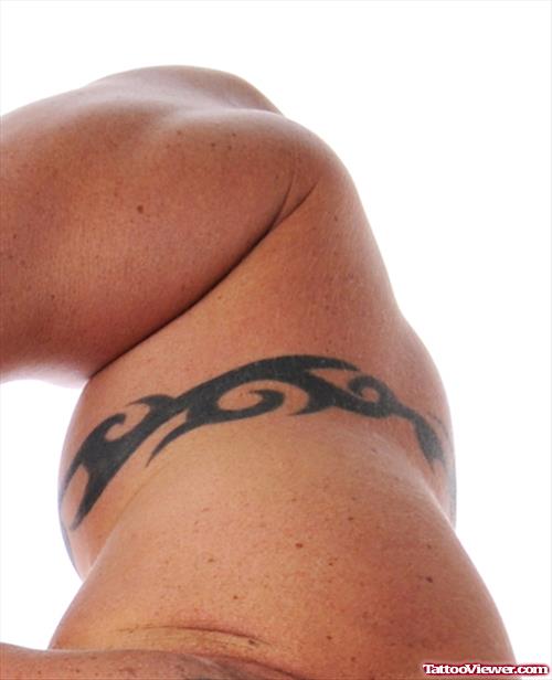 Guy With Tribal Armband Tattoo On Muscles