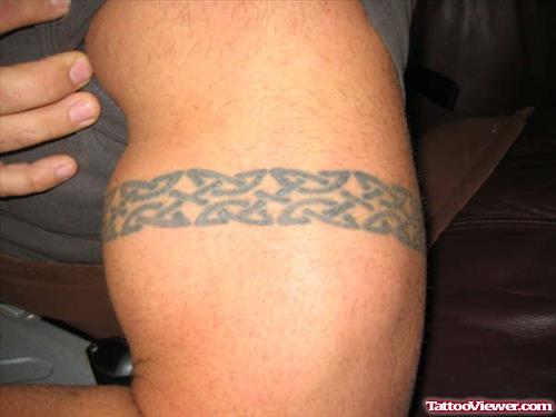 Grey Ink Tribal Armband Tattoo On Left Bicep