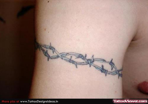 Beautiful Grey Ink Barbed Wire Armband Tattoo On Bicep