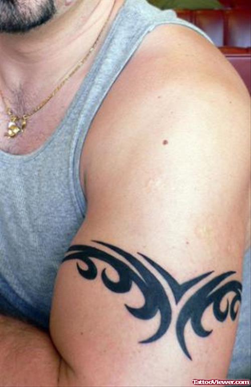 Black Ink Tribalk Armband Tattoo On Man Left Sleeve
