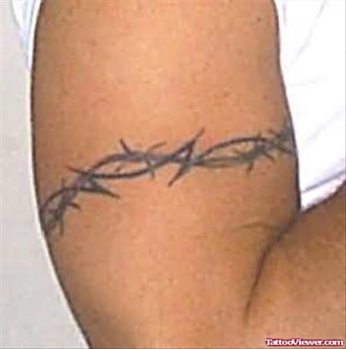Iron Wire Tattoo On Muscles