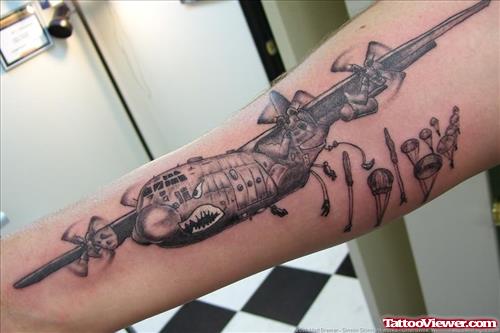 Grey Ink Aeroplane Army Tattoo On Sleeve