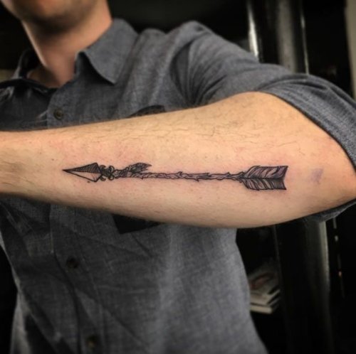 Old Arrow Tattoo On Outer Arm