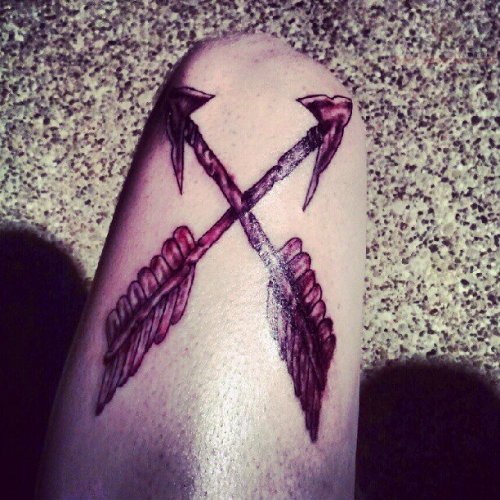 Arrow Cross Tattoo On Thigh