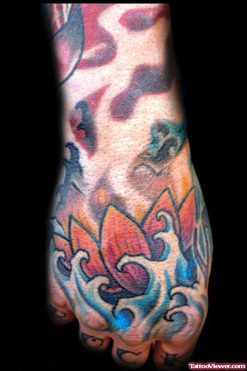 Colored Asian Lotus Flower Tattoo On Hand