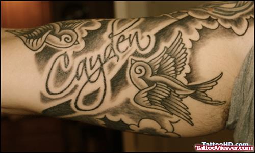 Grey Ink Flying Bird And Asian Tattoo On Half Sleeve