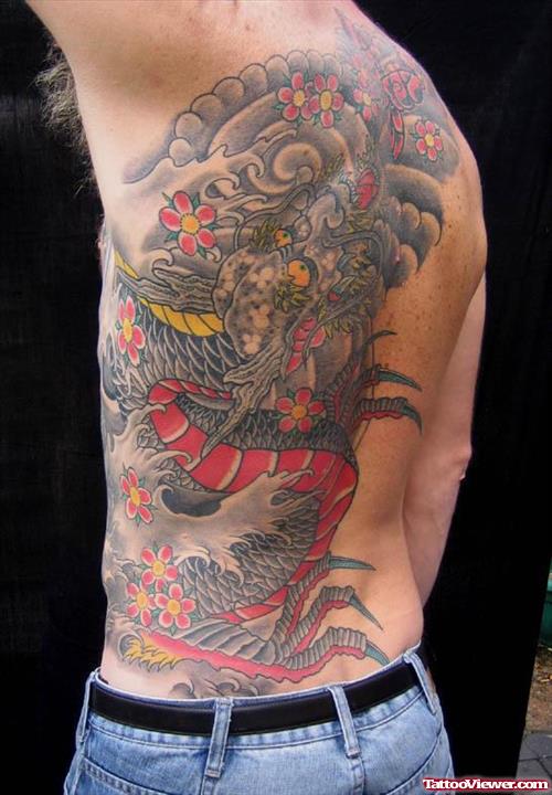 Colored Ink Asian Tattoo On Left Side Rib