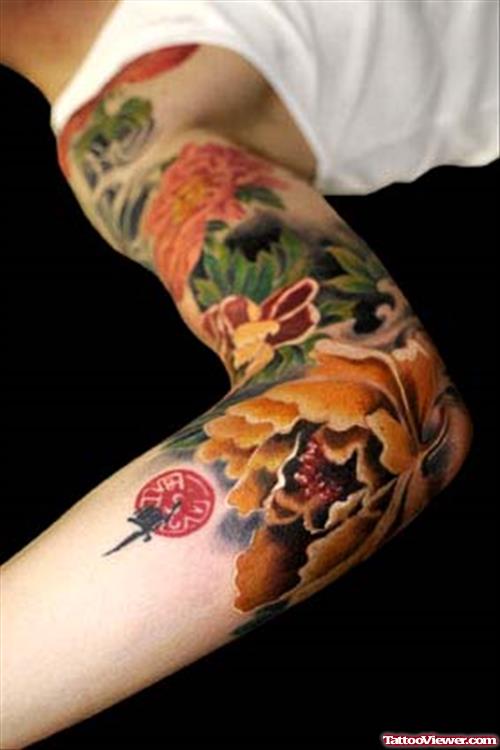 Colored Asian Tattoo On Right Sleeve