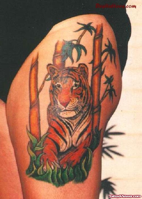 Colored Asian Tattoo On Left Thigh