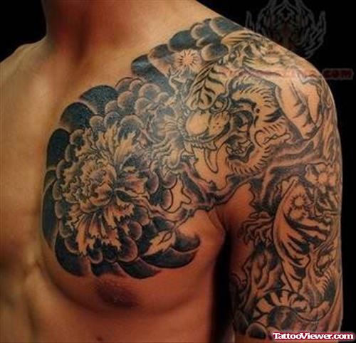Grey Ink Asian Tattoo On Chest And Half Sleeve