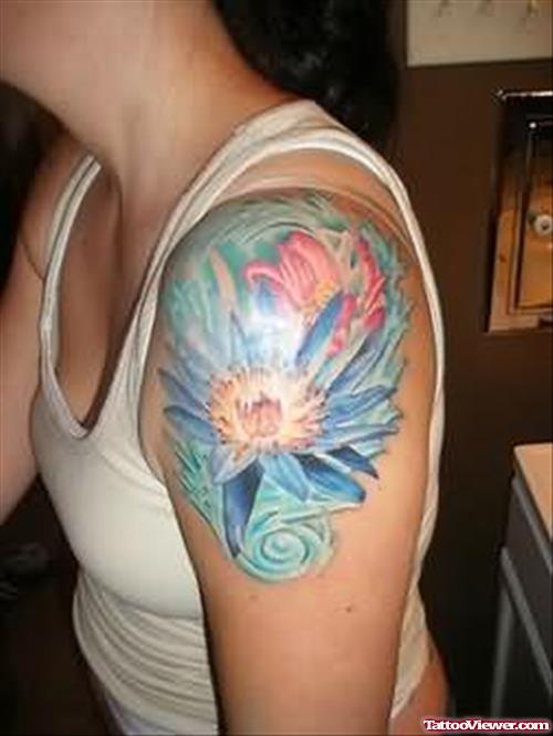 Blue Ink Asian Tattoo On Girl Left Shoulder