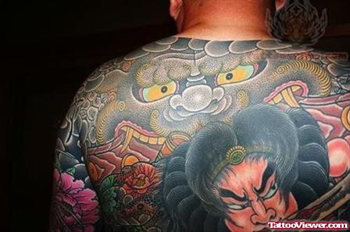 Awesome Color Ink Asian Tattoo On Upperback