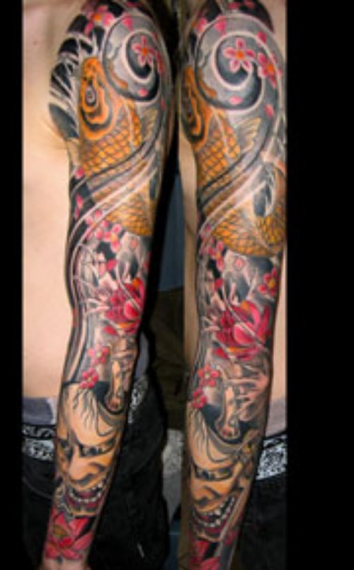 colored Asian Tattoo On Man Left Sleeve