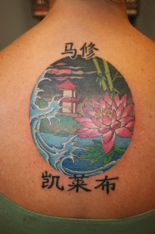 Colored Asian Tattoo On Girl Upperback
