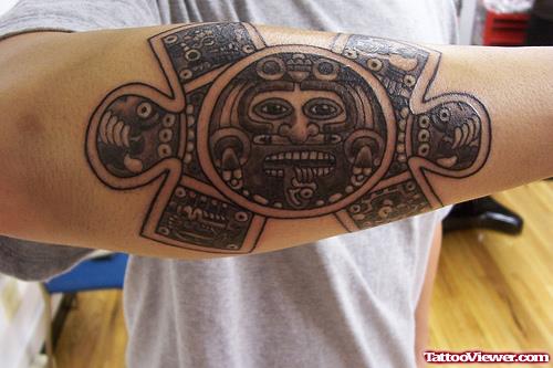 Aztec Head Style Tattoo On forearm